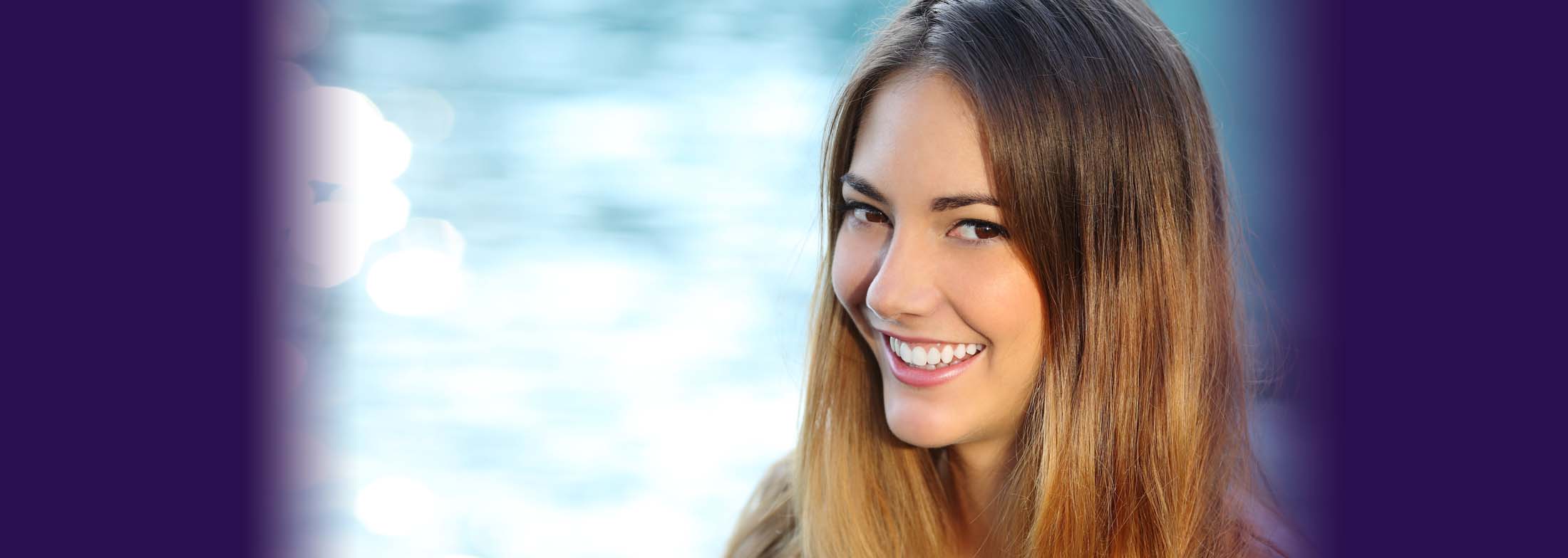 Header image of a woman smiling with a lake in the background